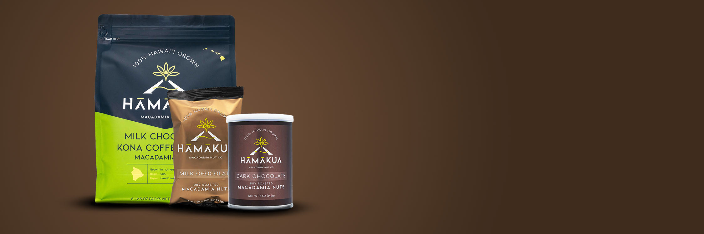 Various Hāmākua Macadamia Nut Co chocolates on a brown gradient background.