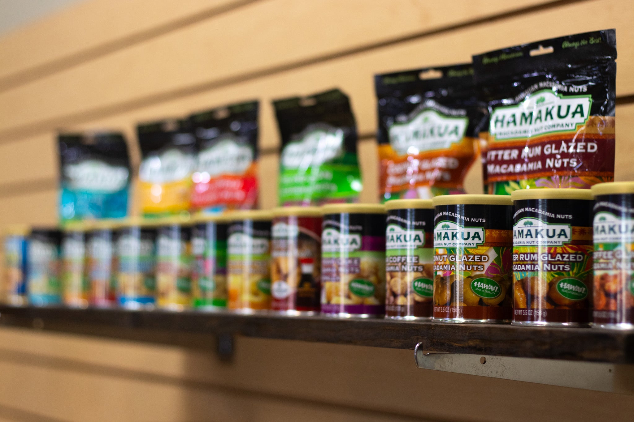 Cans of macadamia nut products located on the wall of the Hāmākua Macadamia Nut Company Visitor Center
