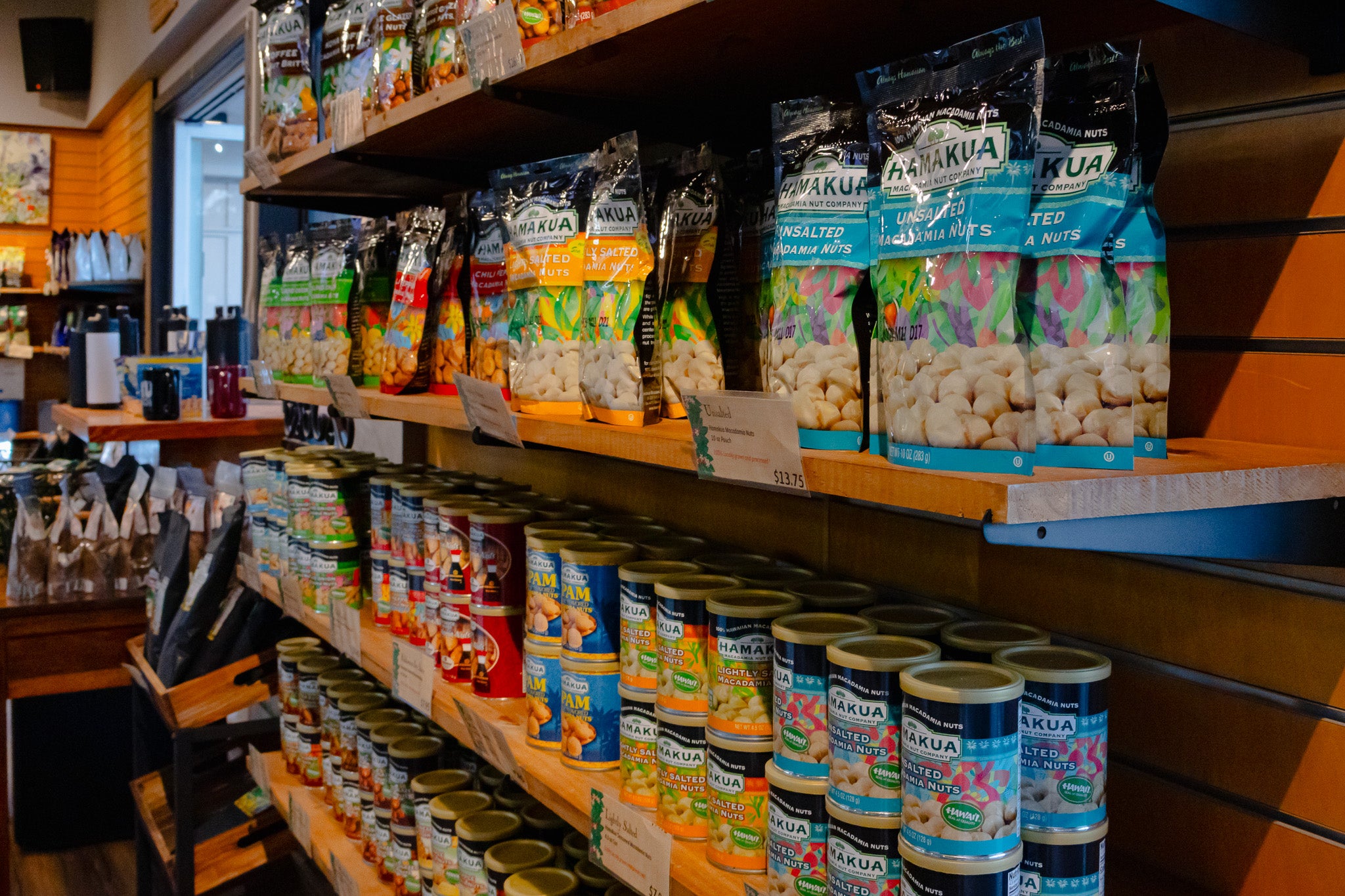 Shelves of Hāmākua Macadamia Nut Company products in Kaʻū Coffee Mill Cafe