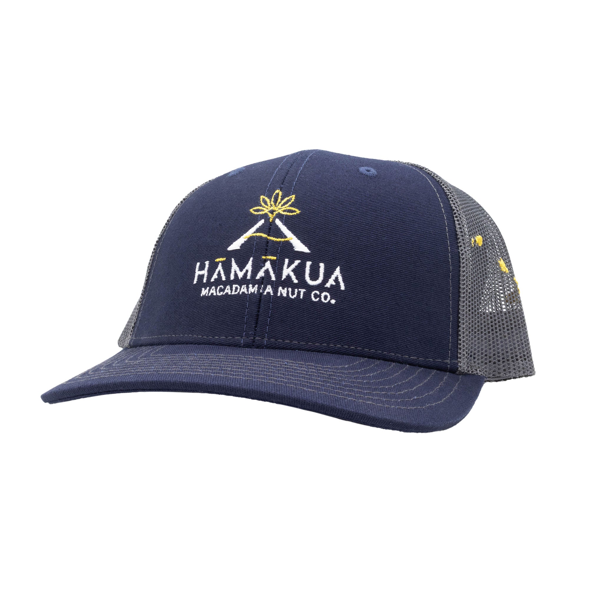 Navy and gray mesh trucker hat with Hāmākua Macadamia Nut Co. logo
