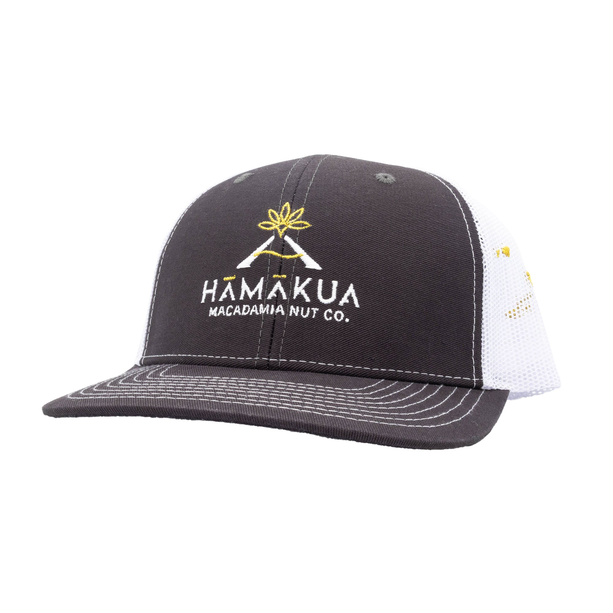 Dark gray and white mesh trucker hat with Hāmākua Macadamia Nut Co. logo