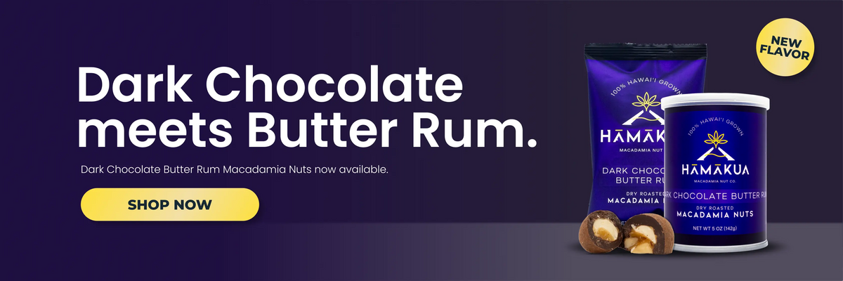 Promotional banner for Hamakua Dark Chocolate Butter Rum, showing a purple bag of the product, two chocolate-covered nuts, and white text reading 'Dark Chocolate Meets Butter Rum' with a yellow 'SHOP NOW' button on a dark purple background.