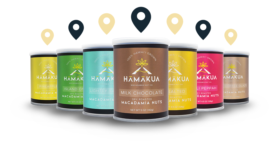 Assorted new Hāmākua Macadamia Nut Company packaging on a white background with location icons above them.