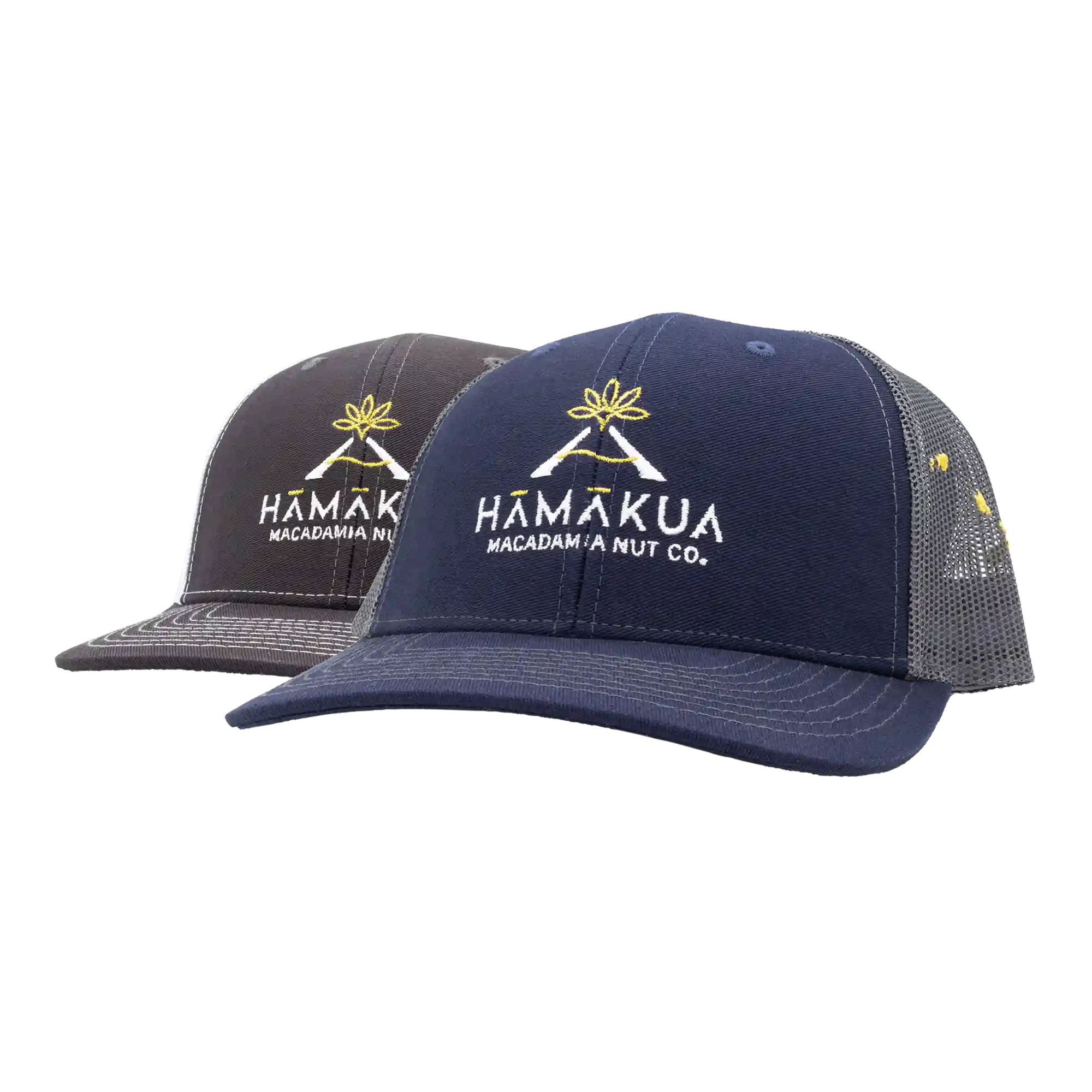 Two trucker hats with Hamakua Macadamia Nut Co. logos